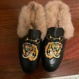 Fur loafers with bit and lion decal
